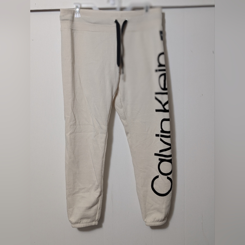 Women's CALVIN KLEIN PERFORMANCE JUMBO LOGO JOGGER PANTS Cream Begie Size Medium